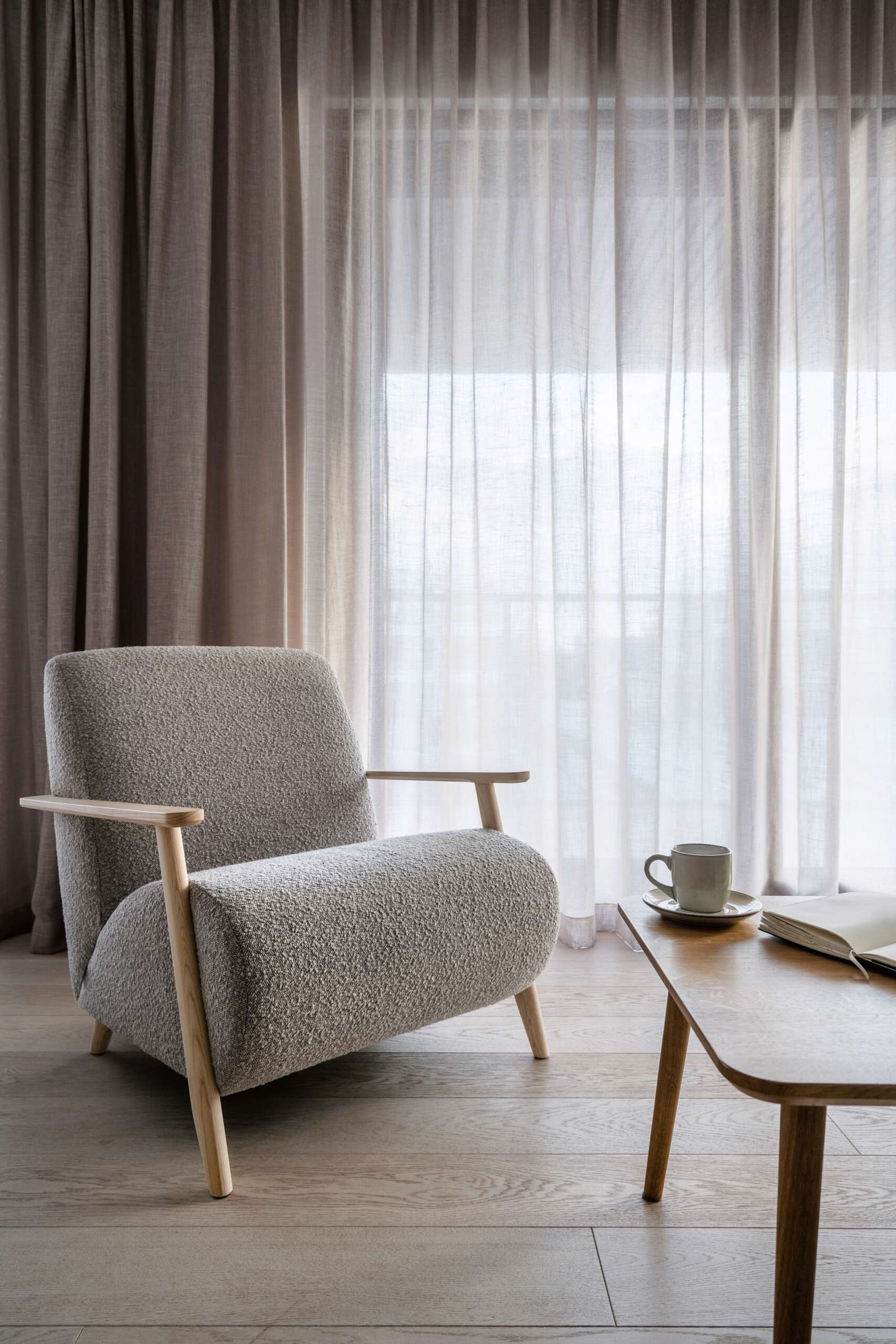 Light,Living,Space,In,Modern,Apartment.,Sophistication,Soft,Grey,Armchair